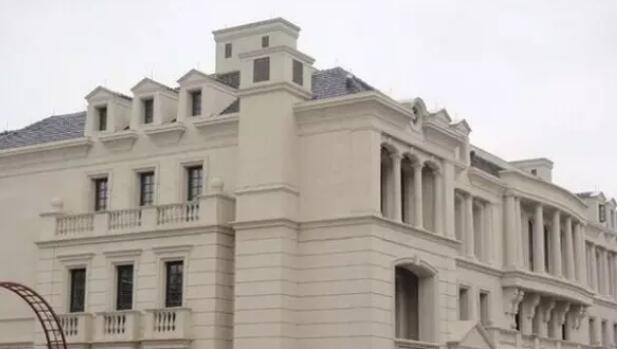 青岛凯旋花园黄金麻石材外墙装修实景效果图