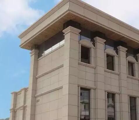 青岛凯旋花园黄金麻石材外墙装修实景效果图